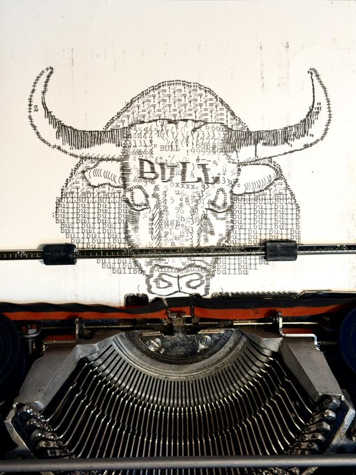 A vintage typewriter displays a sheet of paper where a bull's head illustration is being created using the repeated word "BULL" as the medium, forming both the image and texture of the artwork—a fitting work-in-progress ("wip") piece that demonstrates the word-as-art technique.