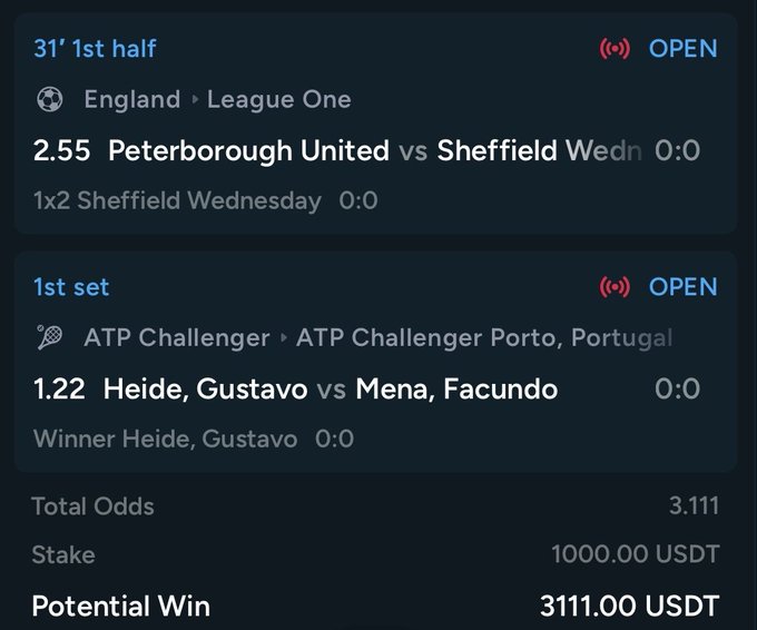 The image shows a betting slip on HouseBets featuring two open wagers: a 1x2 bet on Sheffield Wednesday vs Peterborough United in England's League One (odds 2.55, currently 0:0 at 31 minutes) and a winner bet on Gustavo Heide over Facundo Mena in an ATP Challenger match in Porto, Portugal (odds 1.22, 0:0 in the first set). The combined total odds are 3.111 with a 1000 USDT stake yielding a potential win of 3111 USDT, directly tying to the post's promotion of HouseBets and confidence in Sheffield Wednesday to deliver a winning weekend.