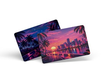 Two Tangem hardware wallet cards featuring vibrant designs are displayed—one showcasing a tropical palm tree sunset in pink and purple hues, and the other depicting a Miami-style cityscape skyline at dusk, both presented as options for a special edition U.S. design collaboration.