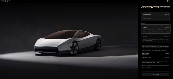 The image shows Tesla's website page for the new-generation Roadster, displaying a sleek white sports car alongside a reservation form requiring a $5,000 "Due Today" deposit (with a total of $45,000) and an estimated production date of Spring 2026. This aligns with the post's mention of the Roadster's delayed arrival after nine years, highlighting Tesla's long-awaited unveiling of the vehicle despite its extended timeline.