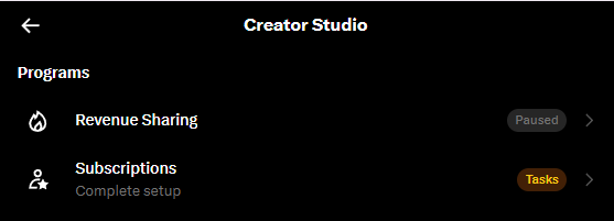 Screenshot of Creator Studio showing Programs including Revenue Sharing (Paused) and Subscriptions with a 'Complete setup' task.