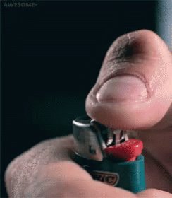 The image shows a person's finger pressing down on a lighter, which has been opened and is now being used as a tool for lighting something. The background of the photo appears to be black, but there are some white text elements that read "awesome" and "$bear". This suggests that the post might have been created by someone who wanted to share an interesting or humorous moment related to the use of a lighter.