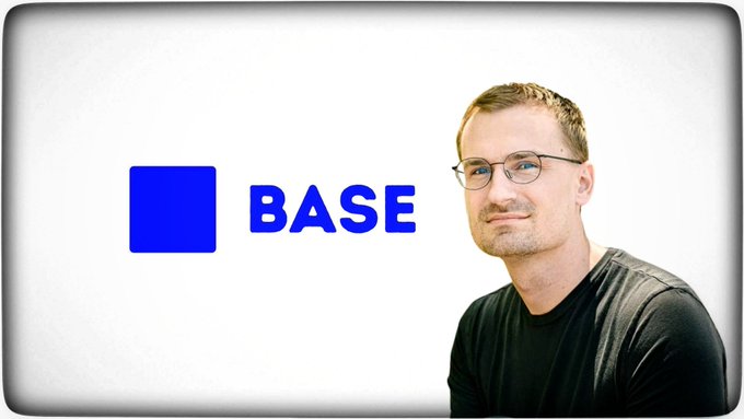 A man wearing glasses and a dark shirt poses next to the blue 'BASE' logo on a white background.