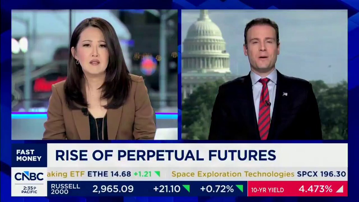 The image shows a news segment featuring two people, one woman and one man, discussing the future of space exploration technologies. The woman appears to be an expert or authority on the subject, while the man seems to be presenting opposing views. They are both wearing suits, indicating that they might be professionals in their field. 

The background features a blue sky with a white building, which could represent a newsroom or studio where the segment was broadcasted. The image also includes text elements such as "HYPE" and "SPCX", possibly referring to specific events or companies related to space exploration technologies.