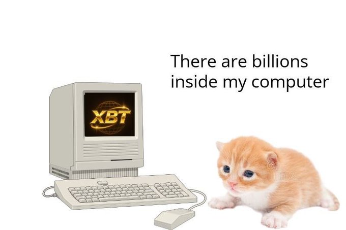 A kitten sits beside a vintage Macintosh computer displaying "XBT" on its screen, with the caption "There are billions inside my computer."