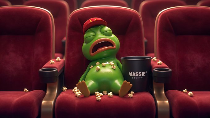 A 3D-rendered green frog wearing a red cap sleeps with its mouth open in a red cinema seat, surrounded by spilled popcorn and a bucket labeled 'WASSIE STUDIOS'.