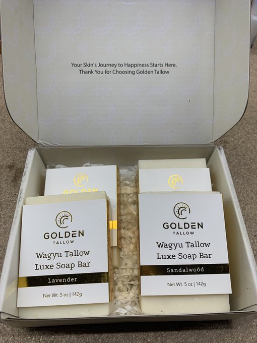 An open gift box from Golden Tallow containing two Wagyu Tallow Luxe Soap Bars, one Lavender and one Sandalwood, with a thank you message inside the lid.