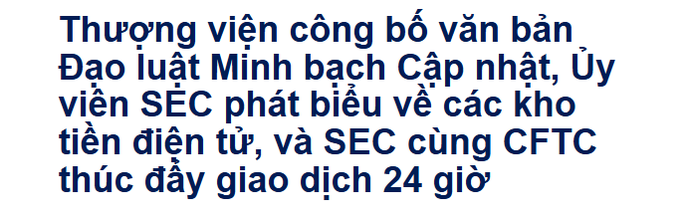 A white sign with blue Vietnamese text that reads: 'Thượng viện công bố văn bản, Đạo luật Minh bạch Cập nhật, Ủy viên SEC phát biểu về các kho tiền điện tử, và SEC cùng CFTC thúc đẩy giao dịch 24 giờ'.