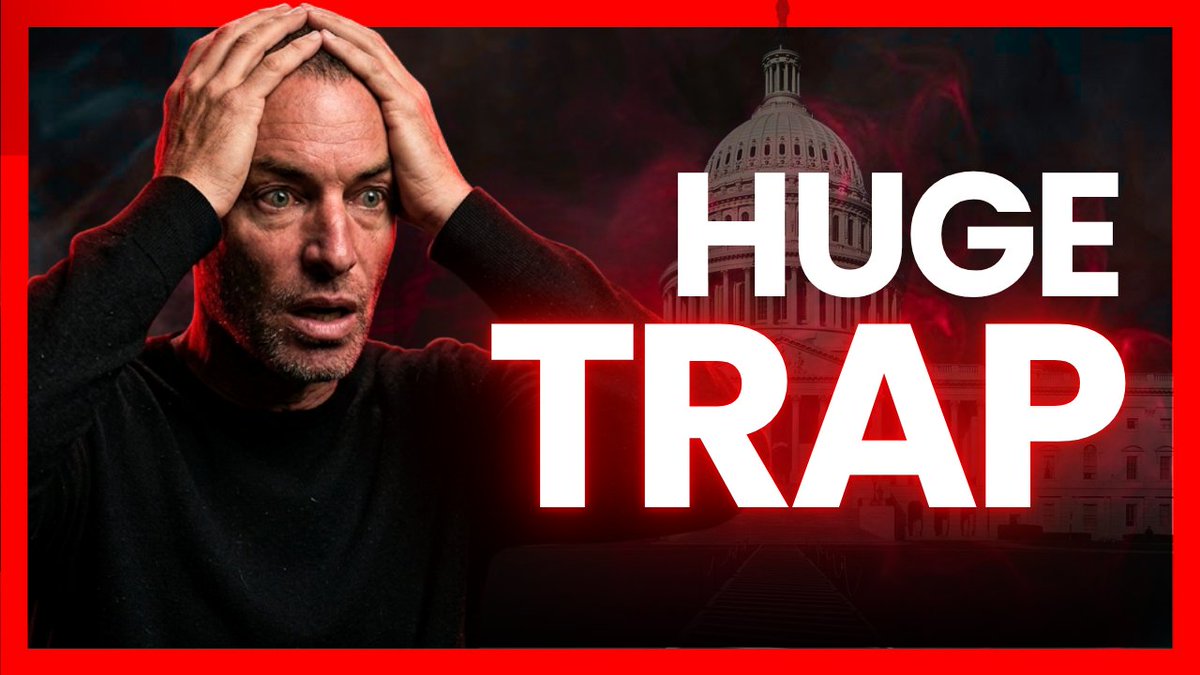 A distressed man holds his head in his hands in front of the U.S. Capitol dome with the bold white text 'HUGE TRAP' displayed on a red background.
