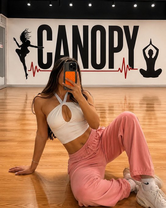 A selfie shows a woman in front of a wall with "CANOPY" written on it, relating to the @CNPYNetwork's $100K token airdrop campaign.