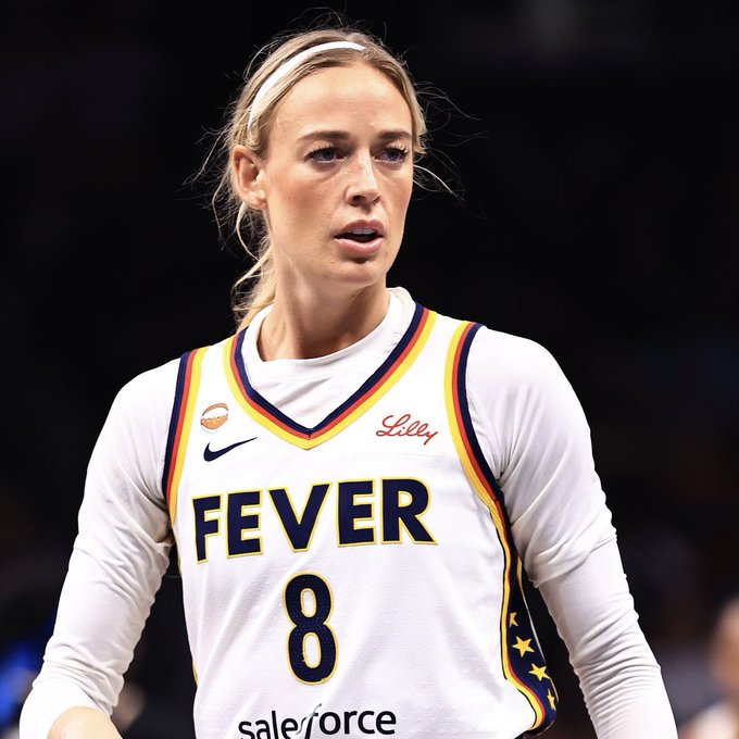 Sophie Cunningham, wearing her Indiana Fever #8 jersey, is shown on the court amid controversy over her public criticism of A'ja Wilson regarding a finger-pointing incident, in which she suggested a double standard exists in WNBA discipline.