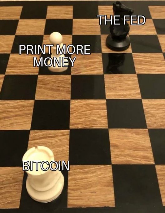 A chessboard shows a white pawn labeled "BITCOIN" facing a black knight labeled "THE FED," while a captured white pawn labeled "PRINT MORE MONEY" sits between them—visually framing the post's message about Bitcoin's impending showdown with central bank monetary policy.