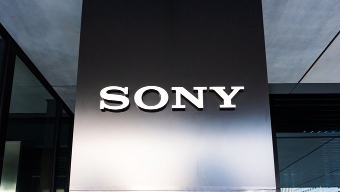 The Sony logo is prominently displayed on a metallic pillar at the entrance of a modern building, symbolizing the company's established brand presence as it moves into the digital finance space with a new U.S. stablecoin trust bank and $40M in initial capital to support blockchain-based services.