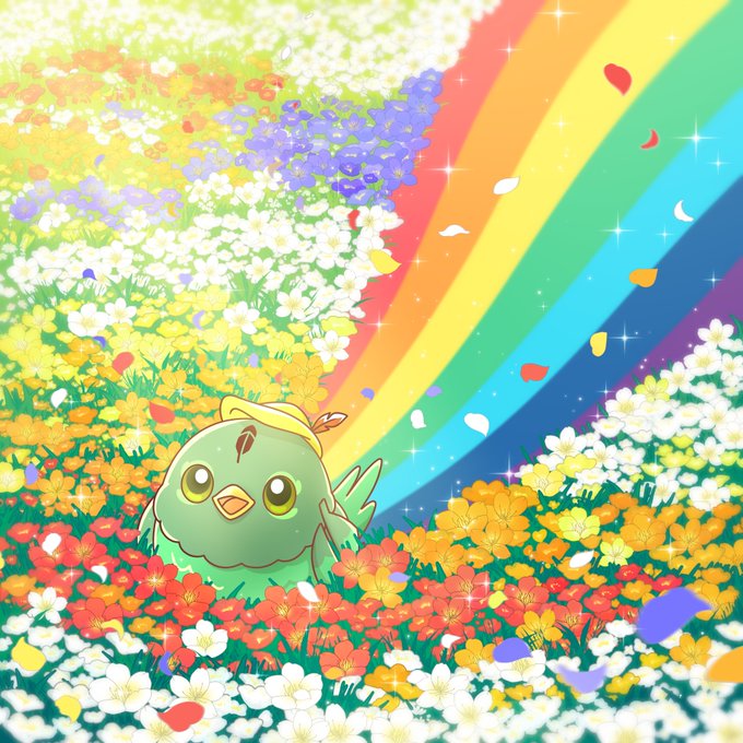 A chubby green cartoon bird named Robbie sits in a vibrant field of multicolored flowers as a bright rainbow arcs across the sky, with sparkling petals drifting around it.