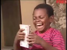 A young boy with a wide, joyous grin is laughing while holding up a stack of cash, his expression radiating pure excitement and disbelief. The image captures a celebratory, heartfelt moment of triumph that visually echoes the post's excitement about securing $693, with the child's euphoric reaction reflecting the gratitude and thrill of a "saved" moment.