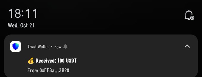 A lock screen notification from Trust Wallet shows a received transaction of 100 USDT from the address 0xEF3a...3B20, supporting the post's mention of receiving a "stimmy" while still coping over missing the $axis opportunity.