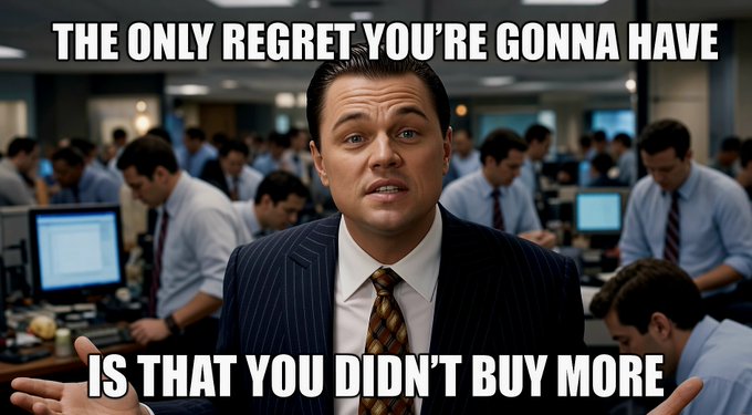 A meme featuring Leonardo DiCaprio as Jordan Belfort from The Wolf of Wall Street with the text 'THE ONLY REGRET YOU'RE GONNA HAVE IS THAT YOU DIDN'T BUY MORE' overlaid on a busy trading floor background.