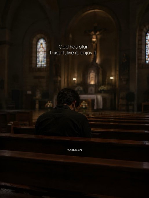 A person sits alone in a dimly lit church pew facing an altar with a crucifix; overlay text reads 'God has plan. Trust it, live it, enjoy it.' with the watermark YAZMEEN.
