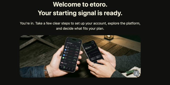 A welcome screen for eToro reading 'Welcome to etoro. Your starting signal is ready,' showing a person using two smartphones displaying the trading app.