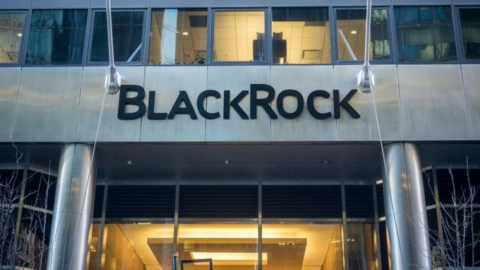 The image shows the exterior of a BlackRock building featuring the company's "BlackRock" signage above its entrance. This relates to the post's news about BlackRock, the world's largest asset manager, selling $202.5 million worth of Bitcoin, suggesting institutional selling pressure in the crypto market.