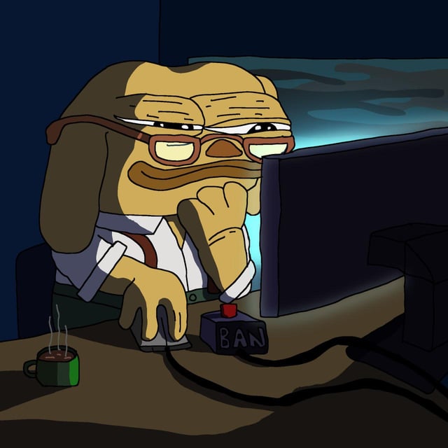 A cartoon image of a dog-like character with glasses sitting at a computer, hand on a large red 'BAN' button, with a coffee mug nearby.