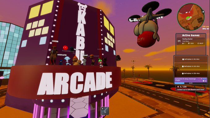 A screenshot of a virtual world game features an 'ARCADE' building labeled 'TKAB' with avatars gathered on top, a floating creature in the sky, and a side panel showing 'Active Games' and 'Rooftop Bucket' along with refresh and in-game message options.