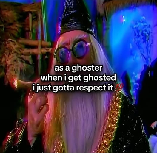 A wizard with a long white beard, round blue-tinted glasses, and a tall pointed hat points upward while standing in front of a colorful, neon-lit background. Text overlaid on the image reads: "as a ghoster when i get ghosted i just gotta respect it."