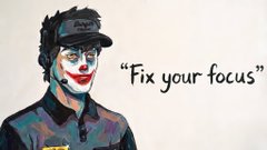 A digital illustration of a person wearing a dark cap with clown-like makeup on their face, accompanied by the text 'Fix your focus' written in black on a white background.