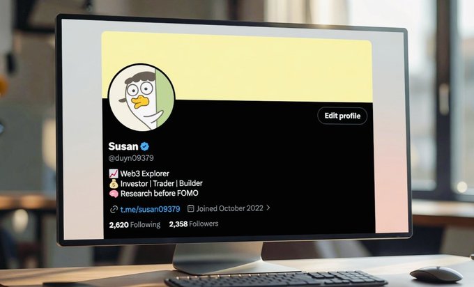 A computer monitor displays a Twitter profile for 'Susan @duyn09379' with a duck avatar, described as a Web3 Explorer, Investor, Trader, Builder, and 'Research before FOMO' with 2,620 Following and 2,358 Followers.