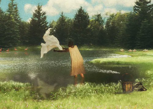 A person in a yellow dress stands by a pond, holding a white cloth aloft in a lush green landscape.