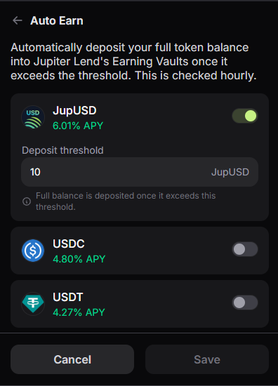 A mobile app screen titled 'Auto Earn' with a dark interface, showing options to automatically deposit token balances into Jupiter Lend's Earning Vaults, with a toggle enabled for JupUSD (6.01% APY) at a deposit threshold of 10, and disabled toggles for USDC (4.80% APY) and USDT (4.27% APY).