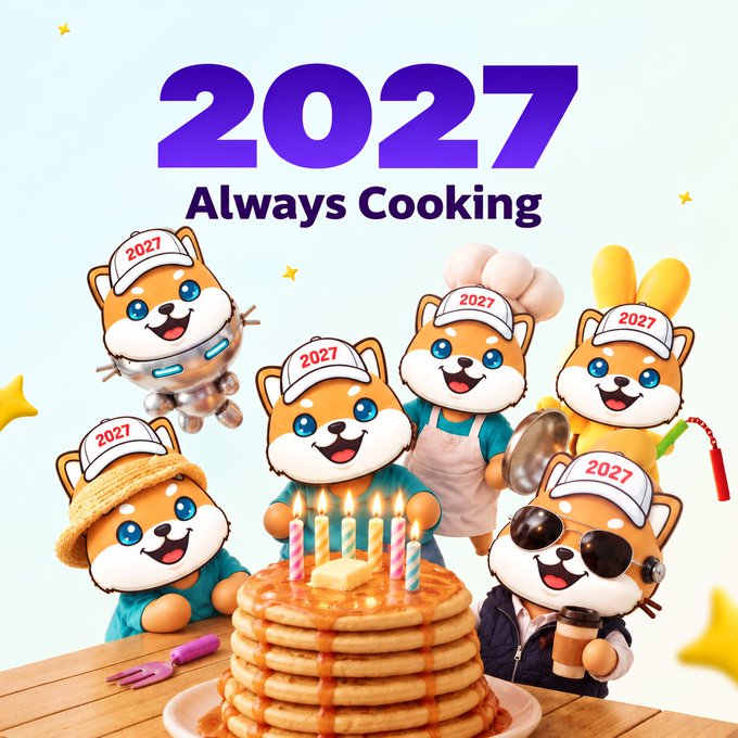 A digital illustration featuring cartoon dogs wearing '2027' hats gathered around a stack of pancakes with lit candles, with the text '2027 Always Cooking'.