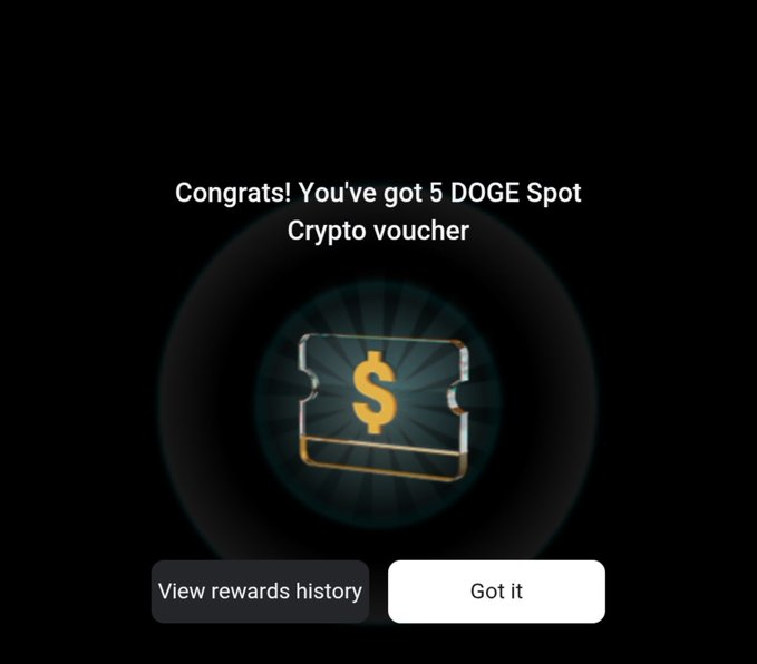 A pop-up notification congratulating the user on receiving a 5 DOGE Spot Crypto voucher, displayed with a glowing ticket icon featuring a dollar sign and two buttons for "View rewards history" and "Got it." This visually confirms the Silver key reward mentioned in the post about the KCGI 2025 Treasure Hunt rewards earned through trading participation.