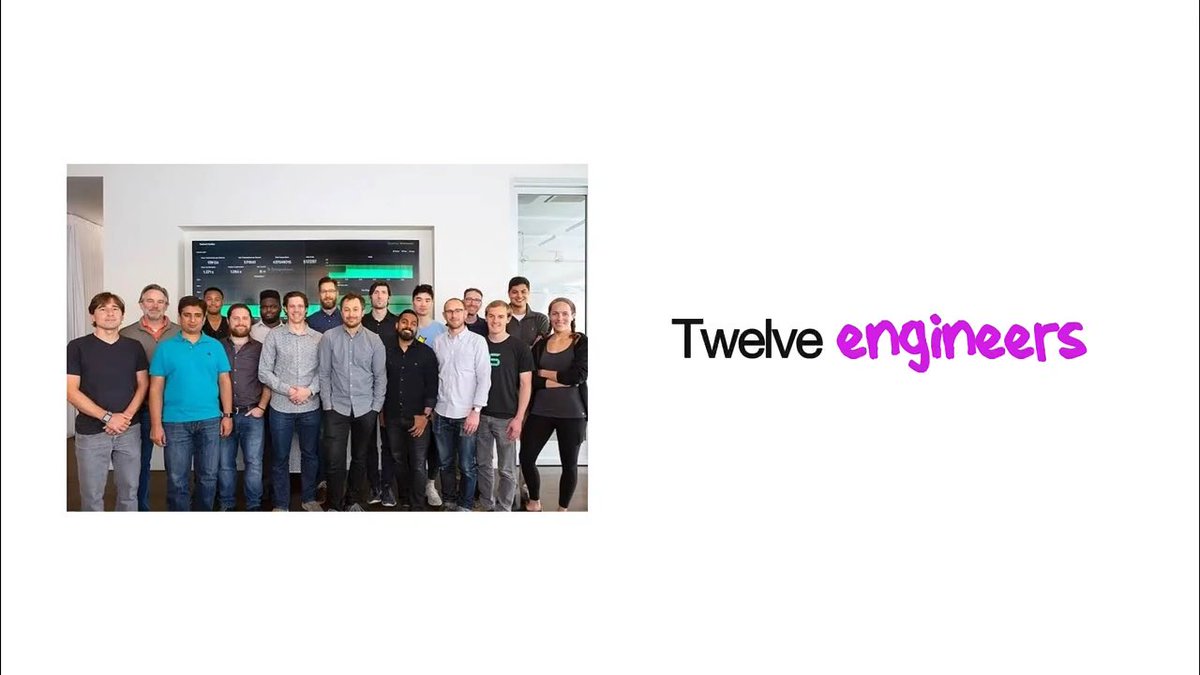 A group photo of approximately fourteen people standing in front of a screen displaying green data. To the right of the photo, text reads 'Twelve engineers' with 'engineers' written in pink script.