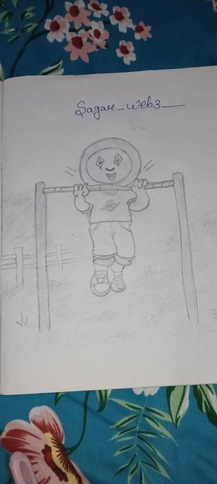 A pencil sketch in a notebook on a floral fabric background, showing a cartoon character hanging from a bar, with the text 'Sagar_web3' written above the drawing.