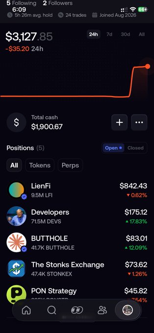 A screenshot of a mobile trading app interface displaying a portfolio value of '$3,127.85' and total cash of '$1,900.67', listing open positions such as 'LienFi', 'Developers', 'BUTTHOLE', and 'The Stonks Exchange'.