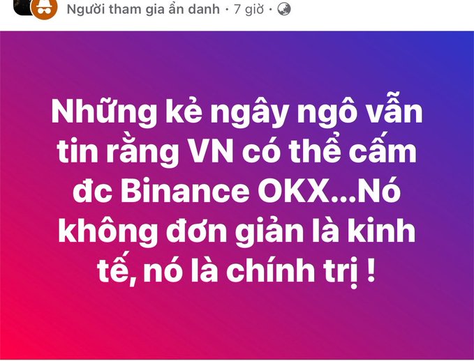 A post by "Người tham gia ẩn danh" features Vietnamese text on a purple-to-pink gradient background that reads: "Những kẻ ngày ngô vẫn tin rằng VN có thể cấm dc Binance OKX…Nó không đơn giản là kinh tế, nó là chính trị !" — translating to "Those fools still believe Vietnam can ban Binance/OKX... It's not simply economics, it's politics!" The image reinforces the accompanying commentary by highlighting the political (rather than purely economic) nature of Vietnam's stance on major crypto exchanges like Binance and OKX.