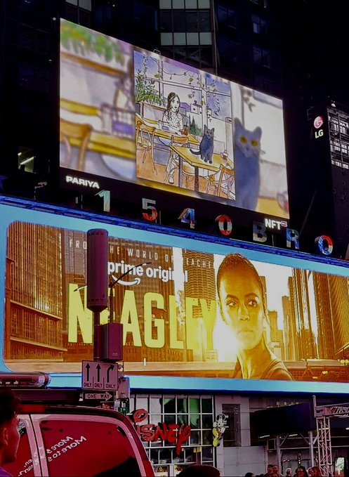 A nighttime view of large digital billboards in New York City's Times Square, including a PARTYNEXTDOOR '1540' countdown clock and a Prime Video advertisement for 'The World of NAGLE'.