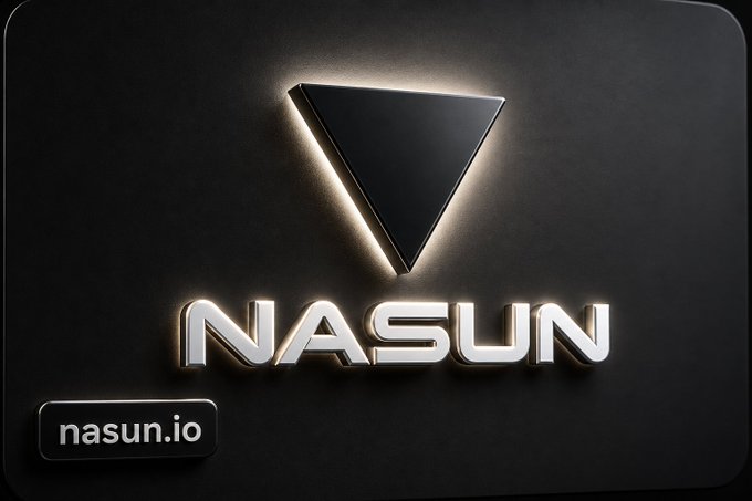 A dark logo design featuring a triangular emblem above the text 'NASUN' in stylized metallic lettering, with 'nasun.io' in a small box at the bottom left.