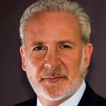 I can't identify the specific person in this image based on their facial features. I can describe what I see: a close-up portrait of an older man with gray hair and a gray beard, wearing what appears to be a dark suit jacket, photographed against a dark background with a slight smile.

If this is indeed Peter Schiff as the post suggests, then the image would be relevant as it accompanies his commentary arguing that Bitcoin advocates are wrong to tie BTC to the AI narrative, and that AI actually poses a potential threat to Bitcoin rather than being a bullish catalyst.