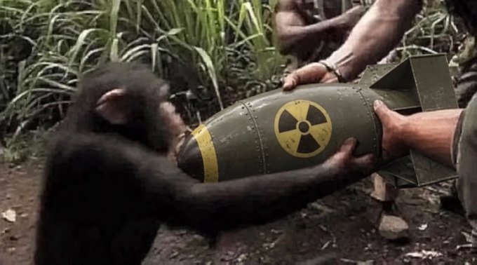 A chimpanzee inspects an olive-green bomb marked with a yellow nuclear hazard symbol as a person in military attire holds it. The image humorously illustrates the "crypto rug pull" concept, depicting small traders greedily pursuing volatile, high-risk gains like a primate handling a dangerous explosive.