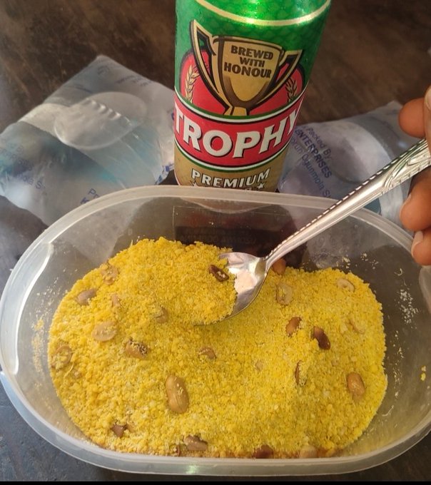 A close-up shows a yellow powdery food with beans in a plastic container, accompanied by a 'Trophy Premium' beer can.