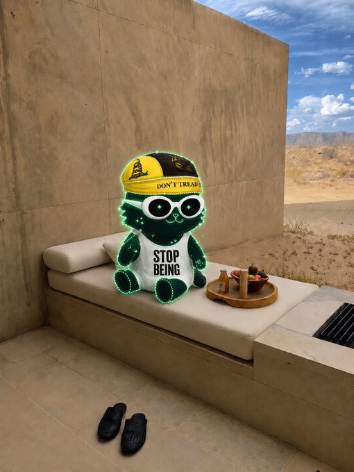 A surreal 3D-rendered scene of a glowing green alien-like character wearing a 'DON'T TREAD' cap and 'STOP BEING' shirt, sitting on an outdoor daybed with a snack tray, while a pair of black Yeezy shoes rest on the floor.