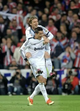 This image shows Real Madrid players Cristiano Ronaldo and Luka Modrić celebrating a goal. The accompanying post mentions a 3-0 win for Spain against Austria, with a bet placed on Binance, possibly referring to this match or a similar one.
