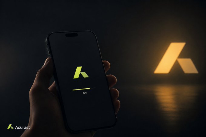 A hand holds a smartphone displaying the Acurast logo with a loading bar at 72%, while a larger illuminated Acurast logo glows in the dark background, visually reinforcing the post's discussion of deploying real Linux workloads on the Acurast platform.
