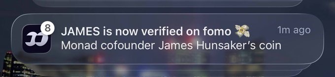 A notification from Fomo (with an '8' badge on the app icon) announces 'JAMES is now verified on fomo' with a bee emoji, adding 'Monad cofounder James Hunsaker's coin' as the subtitle, posted 1m ago.