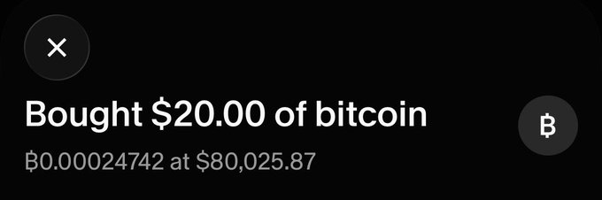 Dark screenshot of a cryptocurrency purchase notification reading "Bought $20.00 of bitcoin, ₿0.00024742 at $80,025.87".