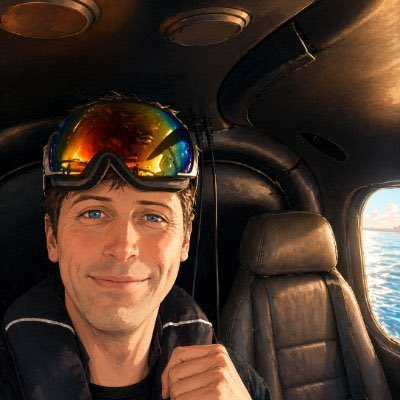 The image features a man wearing goggles, smiling at the camera from inside an airplane seat. The man appears to be enjoying his flight or possibly working as a crypto developer. The photo captures him with a sense of adventure and excitement, showcasing the unique experience of traveling by air.