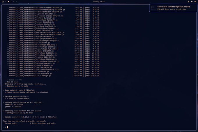 A terminal window showing a build process for 'hermes.cli' with file sizes, build progress messages, and a completion tip about selecting a provider and model, with a screenshot notification in the corner.