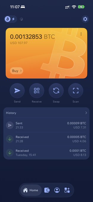 A screenshot of a cryptocurrency wallet app displaying a Bitcoin balance of 0.00132853 BTC (USD 107.97), with options to Send, Receive, Swap, and Scan, and a transaction history showing recent sends and receives.
